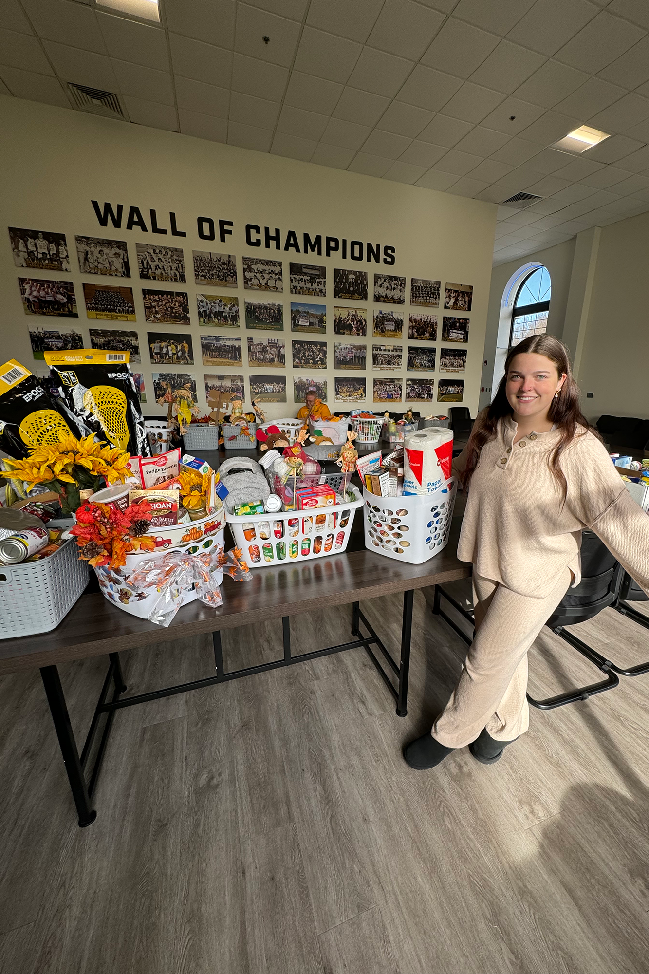 2023-24 SAAC President Marissa Long with donations for AIC SAAC's 2023 Thanksgiving Basket Collection