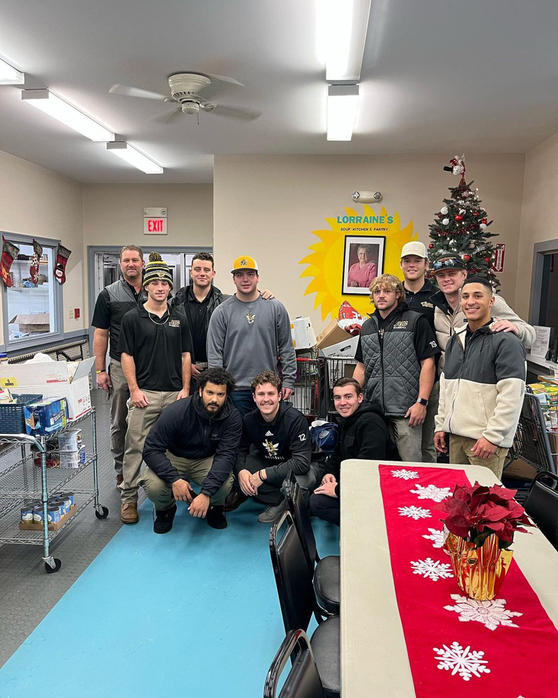 AIC baseball players at Lorraine's Soup Kitchen during their Home Run For The Hungry Campaign